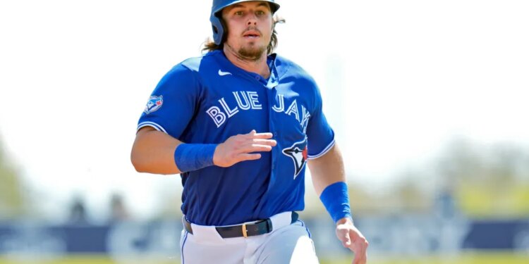 Toronto Blue Jays' Addison Barger runs to third base on a two-run single by Jesus Sanchez during the first inning of an exhibition baseball game against Canada Tuesday, March 3, 2026, in Dunedin, Fla.