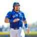 Toronto Blue Jays' Addison Barger runs to third base on a two-run single by Jesus Sanchez during the first inning of an exhibition baseball game against Canada Tuesday, March 3, 2026, in Dunedin, Fla.