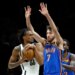 Brooklyn Nets center Nic Claxton(L) tries to drive towards the basket past a defending Oklahoma City Thunder center Chet Holmgren during the first half at the Barclays Center