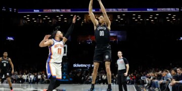Josh Minott, who scored 22 points off the bench, shoots a jumper over Jalen Brunson during the Nets' 93-92 loss to the Knicks on March 20, 2026 at Barclays Center.