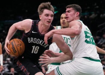 drives to the basket against Boston Celtics center Luka Garza (52) during the second half of an NBA basketball game, Friday, Feb. 27, 2026, in Boston.