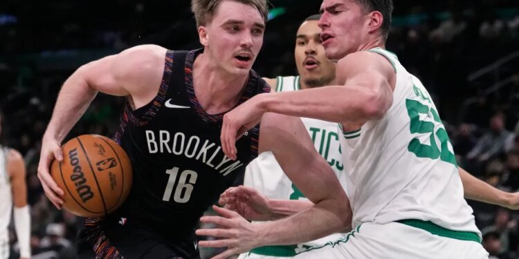 drives to the basket against Boston Celtics center Luka Garza (52) during the second half of an NBA basketball game, Friday, Feb. 27, 2026, in Boston.