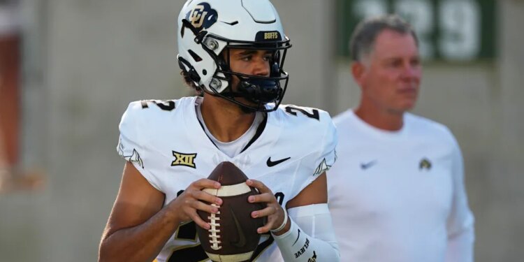 Dominiq Ponder in a Colorado Buffaloes uniform, holding a football.