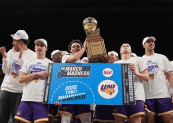 Trey Campbell and teammates celebrating their championship win and March Madness qualification.