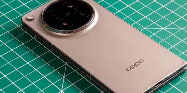 Photo of Oppo Find N6 on a green work mat from above at an angle, closed with the back facing up