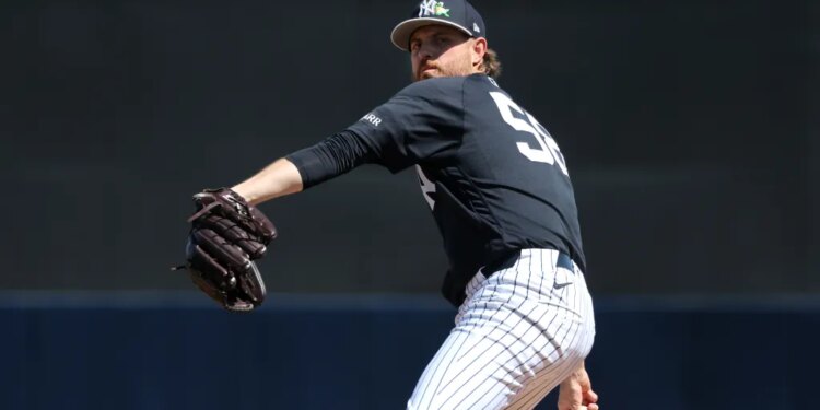 New York Yankees pitcher Paul Blackburn #58, throwing a warmup pitch before the start of the game.