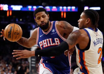 Philadelphia 76ers forward Paul George drives two the basket as New York Knicks guard Miles McBride defends in the first half at Madison Square Garden in Manhattan, New York, Saturday, January 03, 2026.