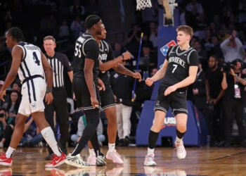 Providence Friars guard Stefan Vaaks (7) celebrates with teammates after scoring.