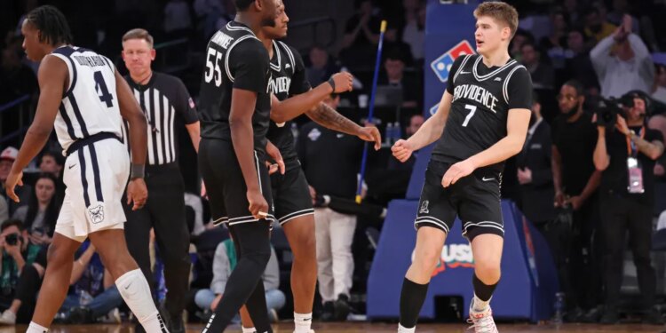 Providence Friars guard Stefan Vaaks (7) celebrates with teammates after scoring.