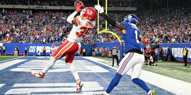 Kansas City Chiefs cornerback Jaylen Watson intercepts a pass intended for New York Giants wide receiver Malik Nabers.