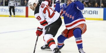 Noah Laba (right), who exited with a lower-body injury, defends against Timo Meier during the second period of the Rangers-Devils game on March 18 2026 at the Garden.