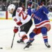 Noah Laba (right), who exited with a lower-body injury, defends against Timo Meier during the second period of the Rangers-Devils game on March 18 2026 at the Garden.
