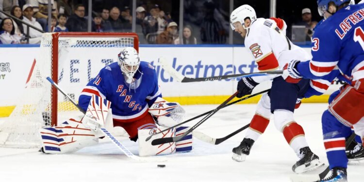 Rangers goaltender Igor Shesterkin (31)makes a save on a shot by the Florida Panthers defenseman Dmitry Kulikov (7) on March 29, 2026.