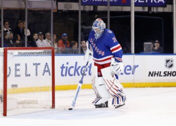 New York Rangers goalie Igor Shesterkin (31) stands on the ice next to the goal.