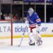 New York Rangers goalie Igor Shesterkin (31) stands on the ice next to the goal.