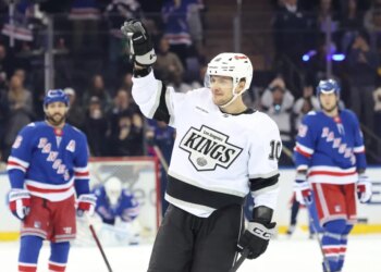Los Angeles Kings player Artemi Panarin waving to fans during a game against the New York Rangers.
