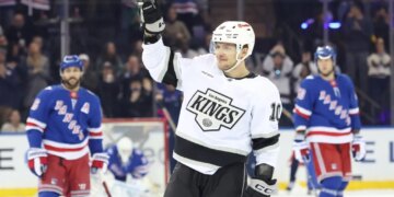 Los Angeles Kings player Artemi Panarin waving to fans during a game against the New York Rangers.