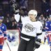 Los Angeles Kings player Artemi Panarin waving to fans during a game against the New York Rangers.