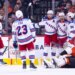 Mika Zibanejad, Adam Fox, Gabe Perreault, and Alexis Lafreniere of the New York Rangers celebrate a goal against Dan Vladar of the Philadelphia Flyers.
