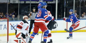 New York Rangers left wing Will Cuylle (50) reacts after defenseman Vladislav Gavrikov (44) scores a goal past New Jersey Devils goaltender Jacob Markstrom (25).