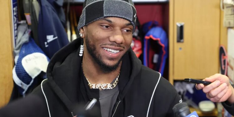 Malik Nabers speaking to media at the New York Giants training facility.