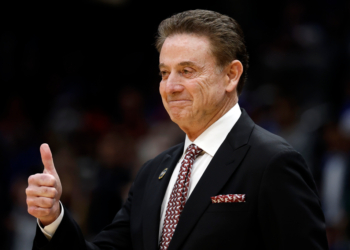 St. John's Red Storm head coach Rick Pitino giving a thumbs up.