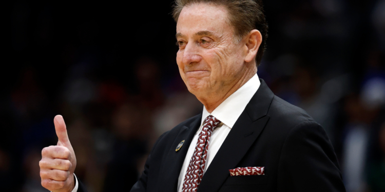 St. John's Red Storm head coach Rick Pitino giving a thumbs up.