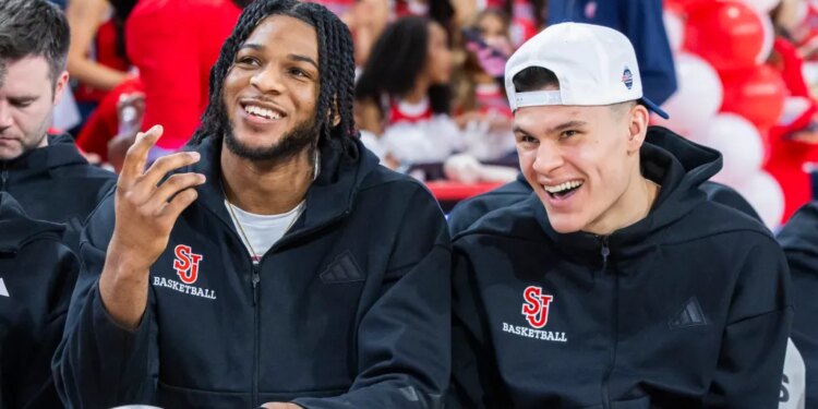 St. John's Red Storm Forward Zuby Ejiofor and Guard Dylan Darling watching the NCAA Men’s Basketball Tournament Selection Show.