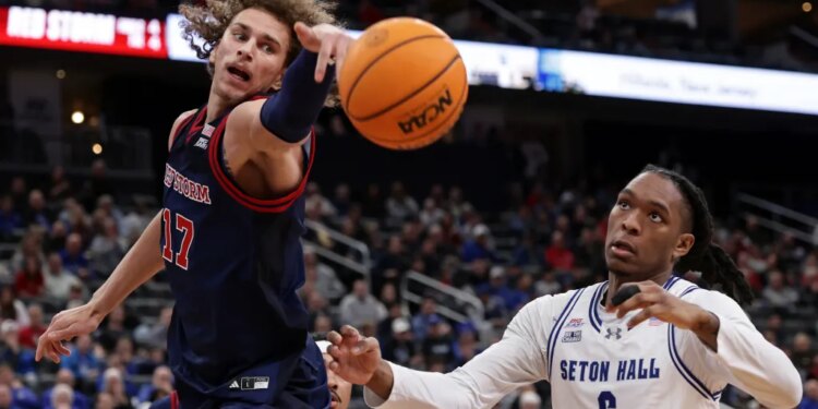 Rubén Prey reaches for a rebound in front of Stephon Payne III during St. John's 72-65 Big East title-clinching win over Seton Hall at Prudential Center on March 6, 2026.