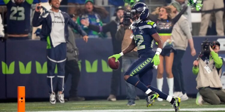 Seattle Seahawks wide receiver Rashid Shaheed (22) runs a kickoff return for a touchdown.