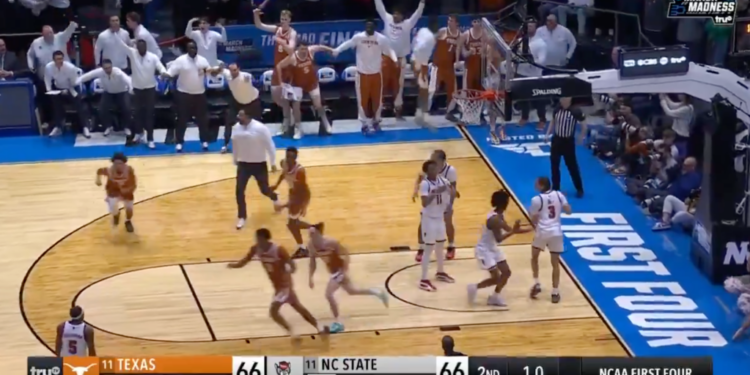 A basketball game with 1.0 seconds left on the clock and the score tied at 66 between Texas and NC State in the NCAA First Four.