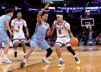 Adam Clark, who scored 16 points, drives on Nik Graves during Seton Hall's 72-61 win over Creighton in a Big East quarterfinal game on March 12, 2026 at the Garden.
