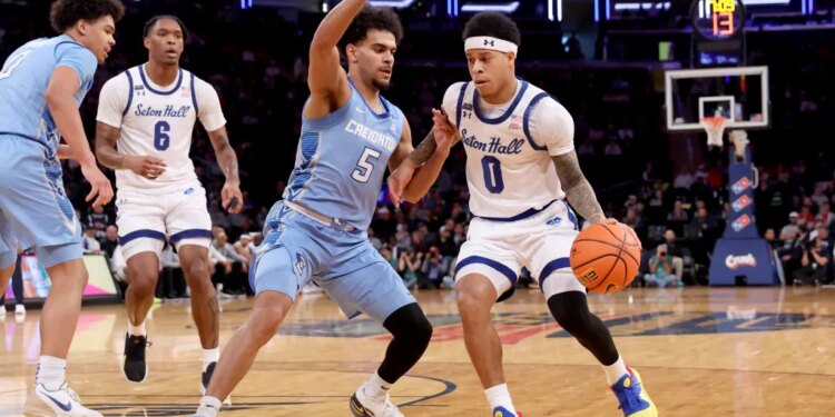 Adam Clark, who scored 16 points, drives on Nik Graves during Seton Hall's 72-61 win over Creighton in a Big East quarterfinal game on March 12, 2026 at the Garden.