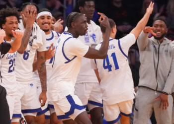 Seton Hall Pirates forward Jacob Dar (1) celebrates a three-point shot with teammates.