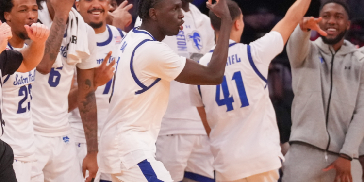 Seton Hall Pirates forward Jacob Dar (1) celebrates a three-point shot with teammates.