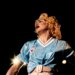 Madonna performing in 1990 in a light blue Celta Vigo soccer jersey.