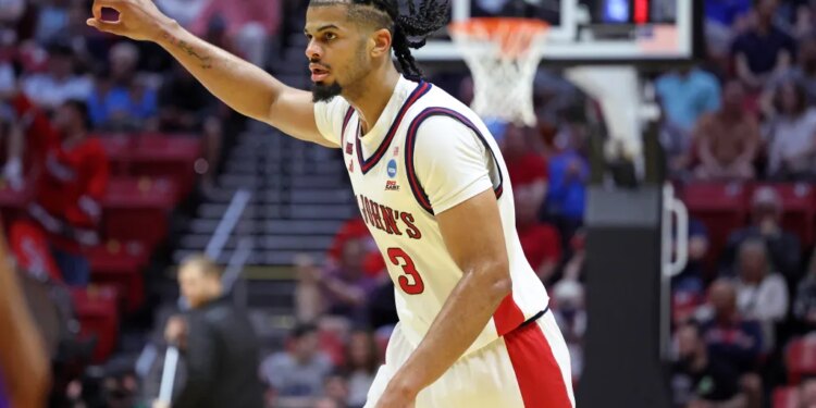 St. John's Red Storm forward Bryce Hopkins #23 reacts after hitting a three-point shot.