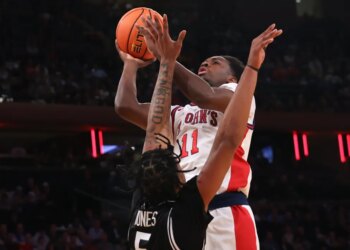 Ian Jackson, who scored 14 points,  shoots over Jamier Jones during St. John's 85-72 win over Providence in a Big East quarterfinal game on March 12, 2026 at the Garden.