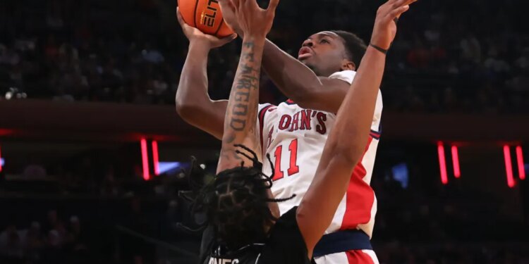 Ian Jackson, who scored 14 points,  shoots over Jamier Jones during St. John's 85-72 win over Providence in a Big East quarterfinal game on March 12, 2026 at the Garden.
