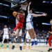 St. John's Red Storm forward Zuby Ejiofor looks to pass past the Duke Blue Devils defense in the first half during the NCAA East Regionals, Sweet Sixteen tournament at Capital One Arena in Washington, DC on March 27, 2026.