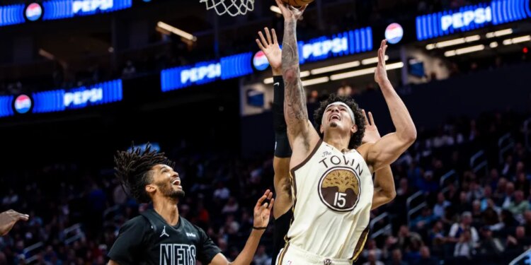 Gui Santos, who scored a game-high 31 points, goes up for a layup as Ziaire Williams looks on during the Nets' 109-106 loss to the Warriors on March 25, 2026 in San Francisco.