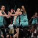 New York Liberty players Breanna Stewart and Sabrina Ionescu high-five during a game against the Phoenix Mercury.