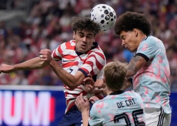 United States' Gio Reyna (7) battles for a header with Belgium's Nathan De Cat (25) during the second half of an international friendly soccer match, Saturday, March 28, 2026, in Atlanta.