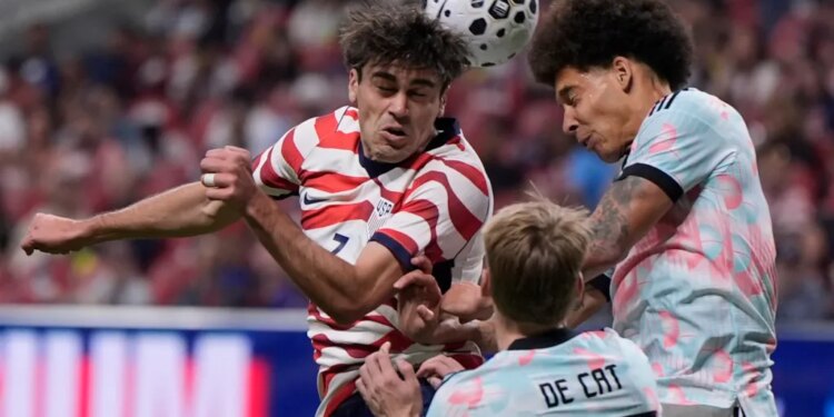 United States' Gio Reyna (7) battles for a header with Belgium's Nathan De Cat (25) during the second half of an international friendly soccer match, Saturday, March 28, 2026, in Atlanta.