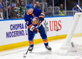 New York Islanders Tony DeAngelo looks to pass during the second period against the Calgary Flames at UBS Arena, Saturday, March 14, 2026.