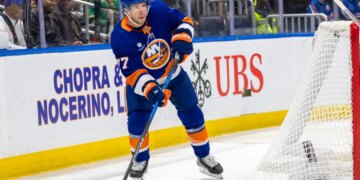 New York Islanders Tony DeAngelo looks to pass during the second period against the Calgary Flames at UBS Arena, Saturday, March 14, 2026.
