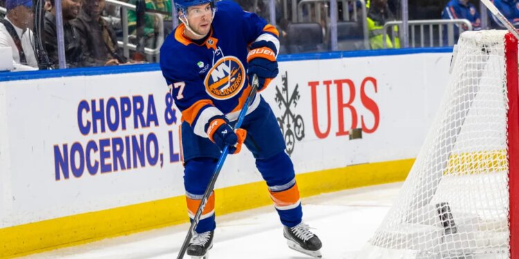 New York Islanders Tony DeAngelo looks to pass during the second period against the Calgary Flames at UBS Arena, Saturday, March 14, 2026.
