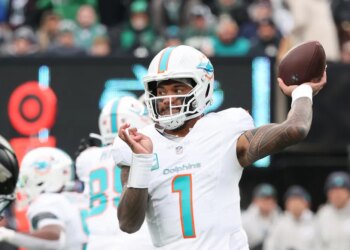 12/7/25 - Miami Dolphins vs. New York Jets at MetLife Stadium - Miami Dolphins quarterback Tua Tagovailoa #1 throws a pass during the third quarter.