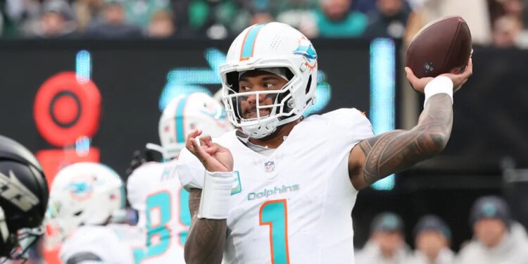 12/7/25 - Miami Dolphins vs. New York Jets at MetLife Stadium - Miami Dolphins quarterback Tua Tagovailoa #1 throws a pass during the third quarter.
