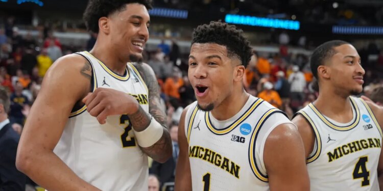 Yaxel Lendeborg, Trey McKenney, and Nimari Burnett celebrate their Sweet 16 victory in the NCAA tournament.